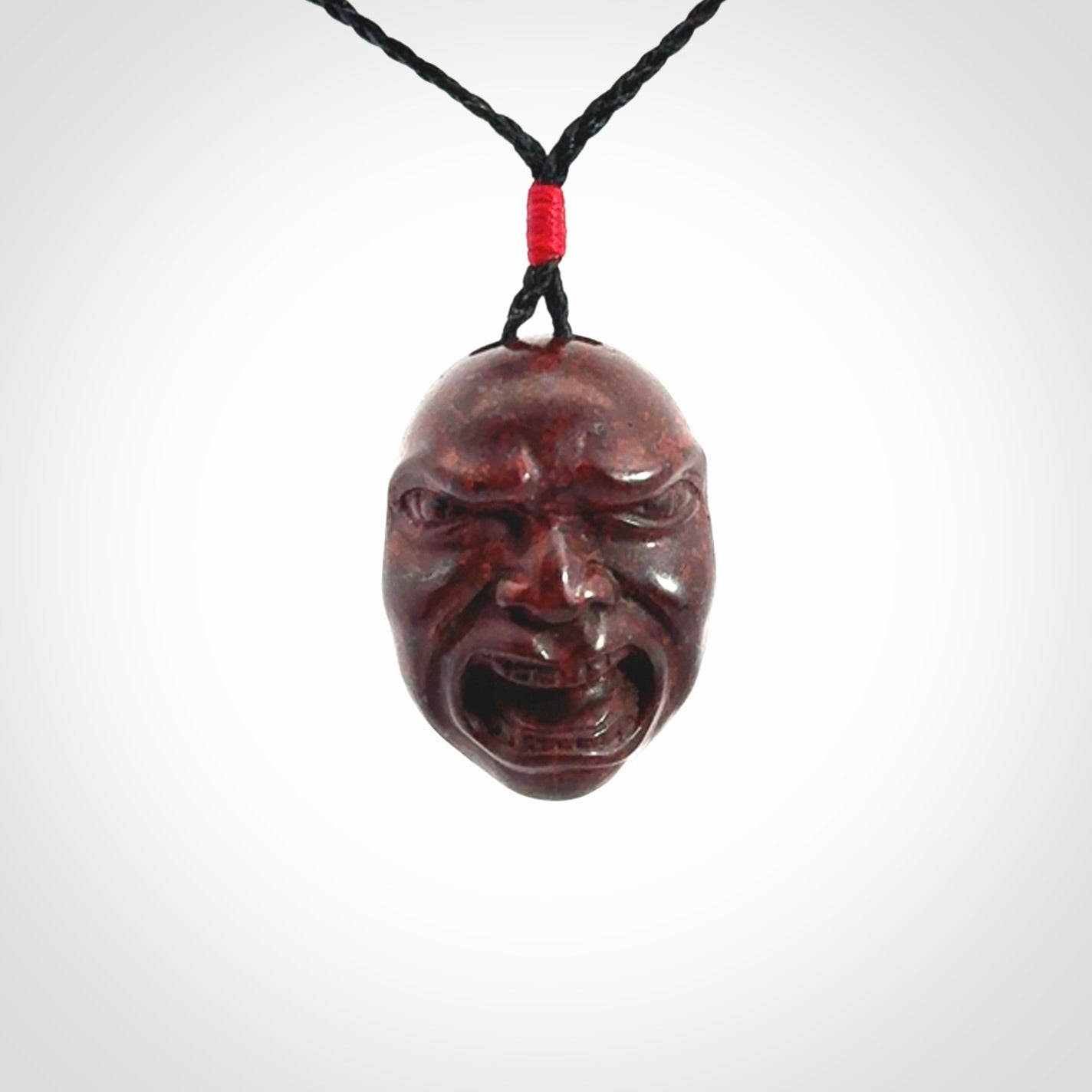 Hand carved jasper stone happy, sad and angry face pendants
