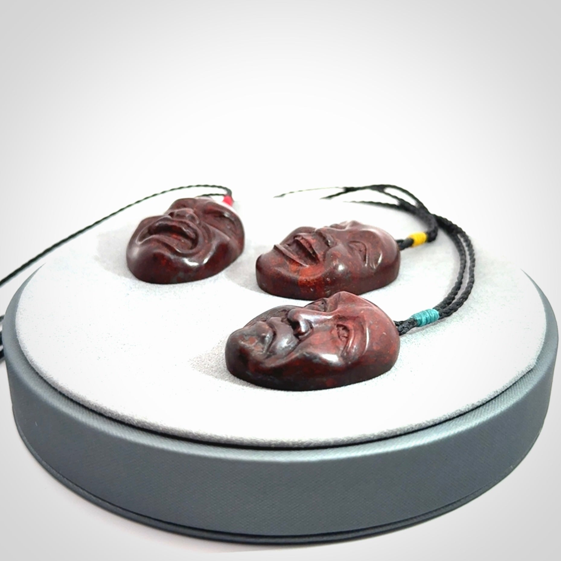 Hand carved jasper stone happy, sad and angry face pendants