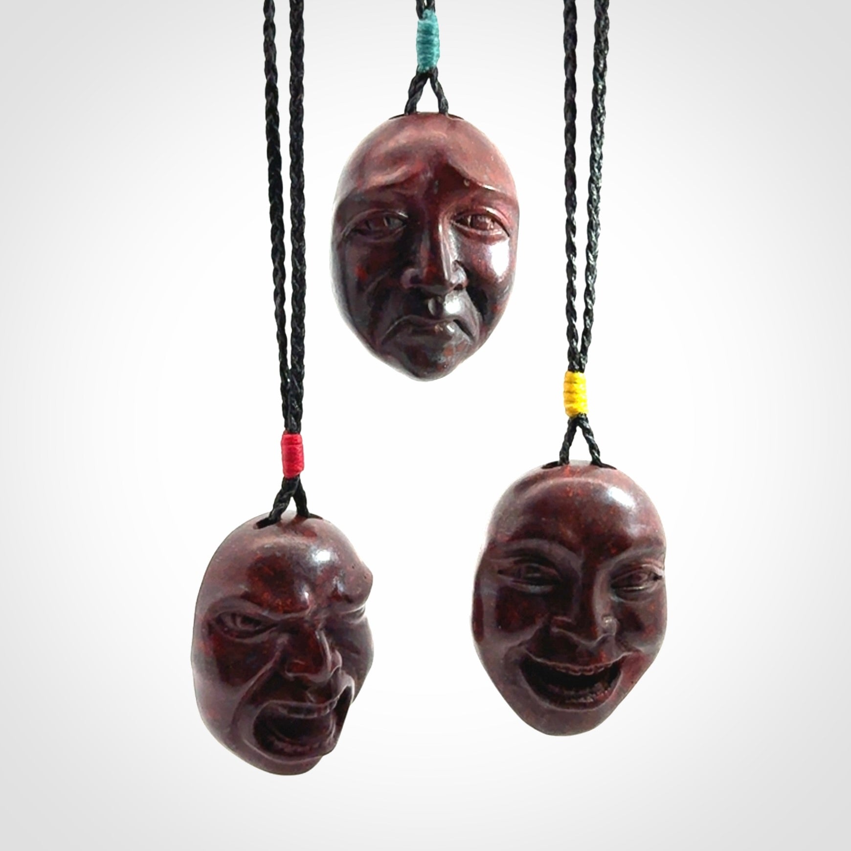 Hand carved jasper stone happy, sad and angry face pendants