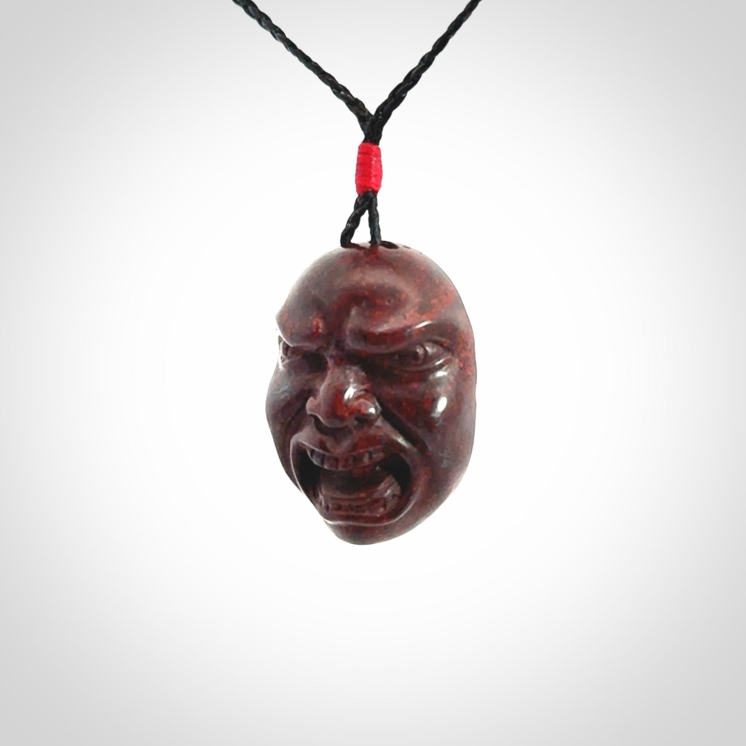 Hand carved jasper stone happy, sad and angry face pendants