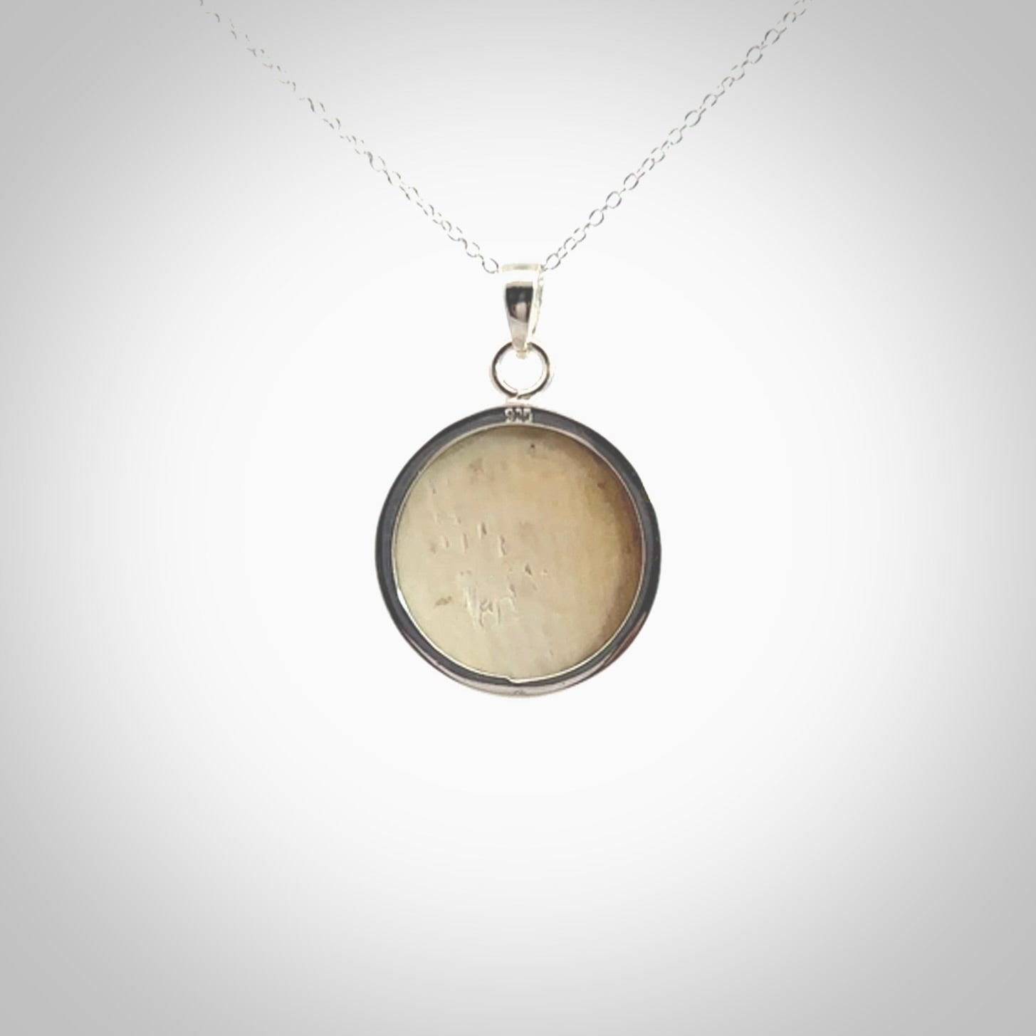 Hand made woolly mammoth tusk moon face necklace. Made by NZ Pacific and sale online only.