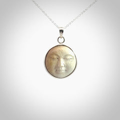 Hand made woolly mammoth tusk moon face necklace. Made by NZ Pacific and sale online only.