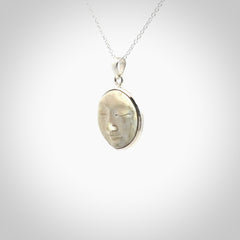 Hand made woolly mammoth tusk moon face necklace. Made by NZ Pacific and sale online only.