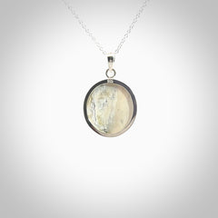 Hand made woolly mammoth tusk moon face necklace. Made by NZ Pacific and sale online only.