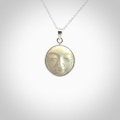 Hand made woolly mammoth tusk moon face necklace. Made by NZ Pacific and sale online only.