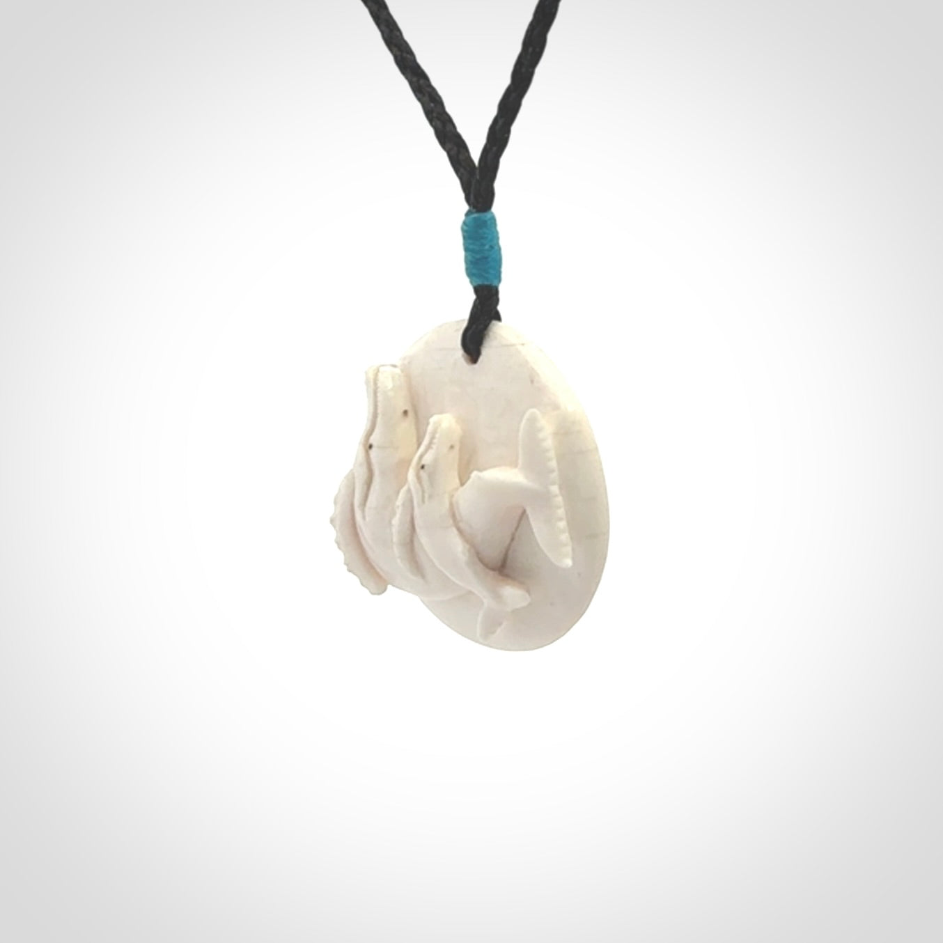 Hand carved woolly mammoth tusk whale pendant