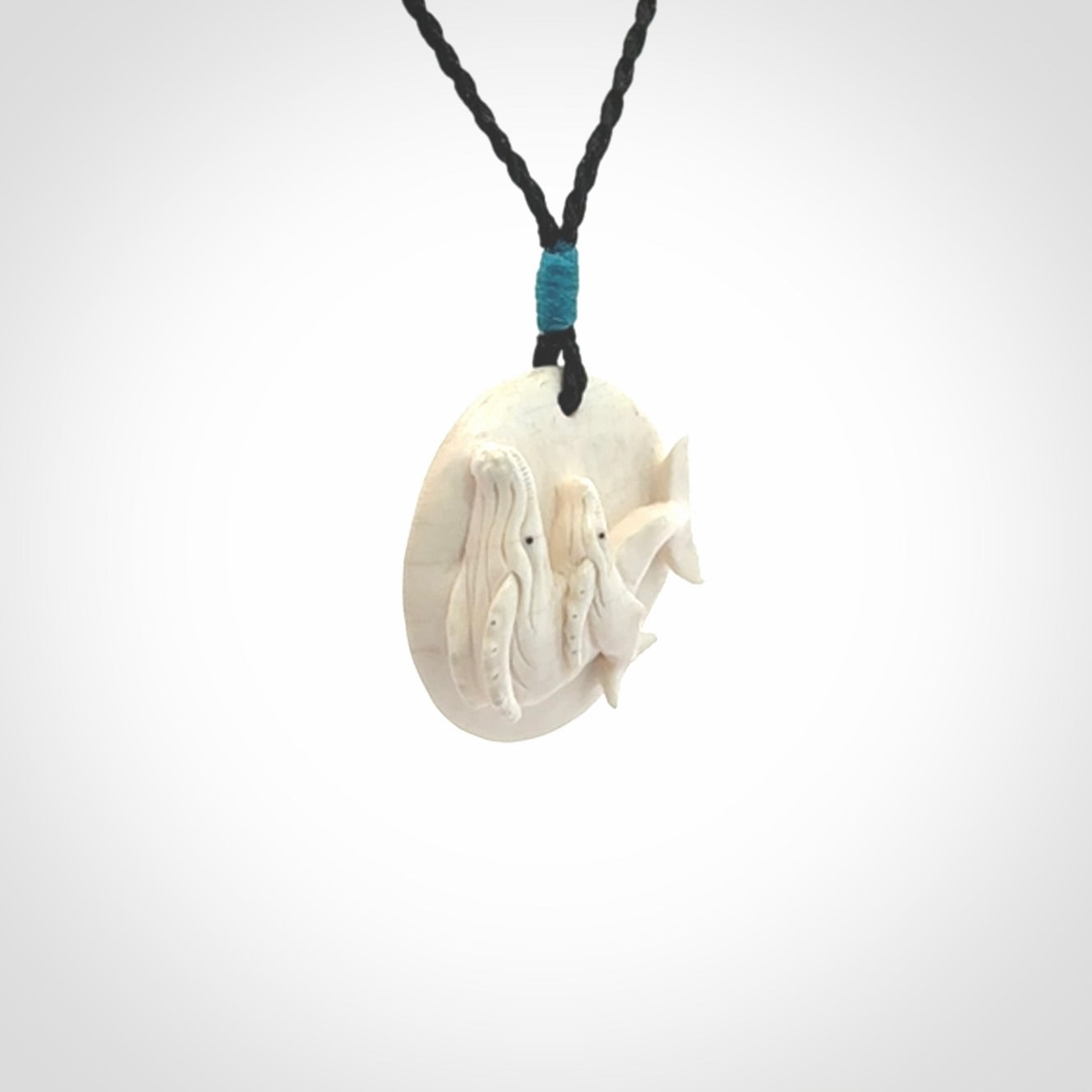 Hand carved woolly mammoth tusk whale pendant