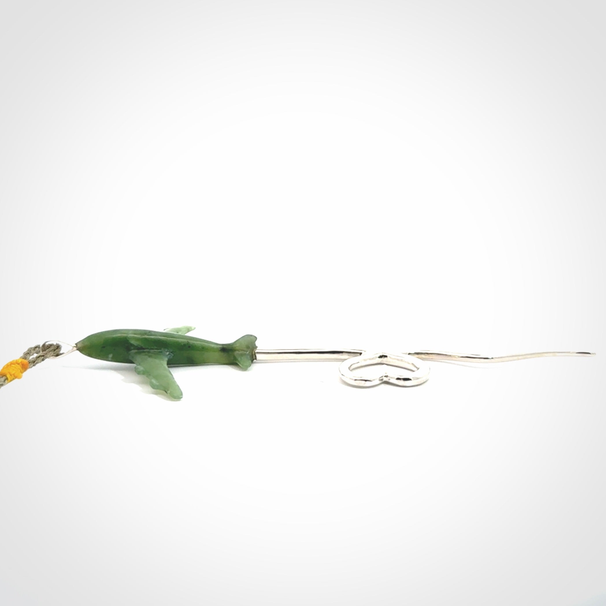 Hand carved plane and heart pendant from Jade with Sterling Silver. This is a very cool piece of jewellery, hand made by NZ Pacific. We provide this with an adjustable cord. Free Postage Worldwide.