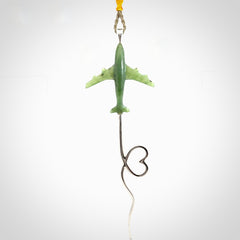 Hand carved plane and heart pendant from Jade with Sterling Silver. This is a very cool piece of jewellery, hand made by NZ Pacific. We provide this with an adjustable cord. Free Postage Worldwide.