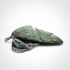 Hand carved New Zealand Jade wheku pendant with paua shell eyes