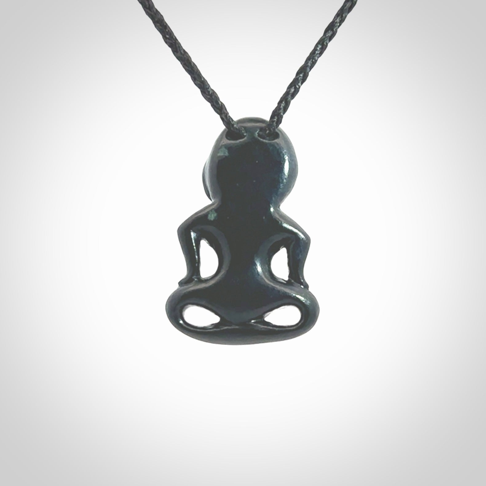 This pendant is a small jade tiki pendant. The carving shows wonderful detail on the front while the back is beautifully rounded. These are carved in New Zealand Jade with paua shell eyes. The cord is adjustable in length. Provided in a woven kete pouch and shipped worldwide.