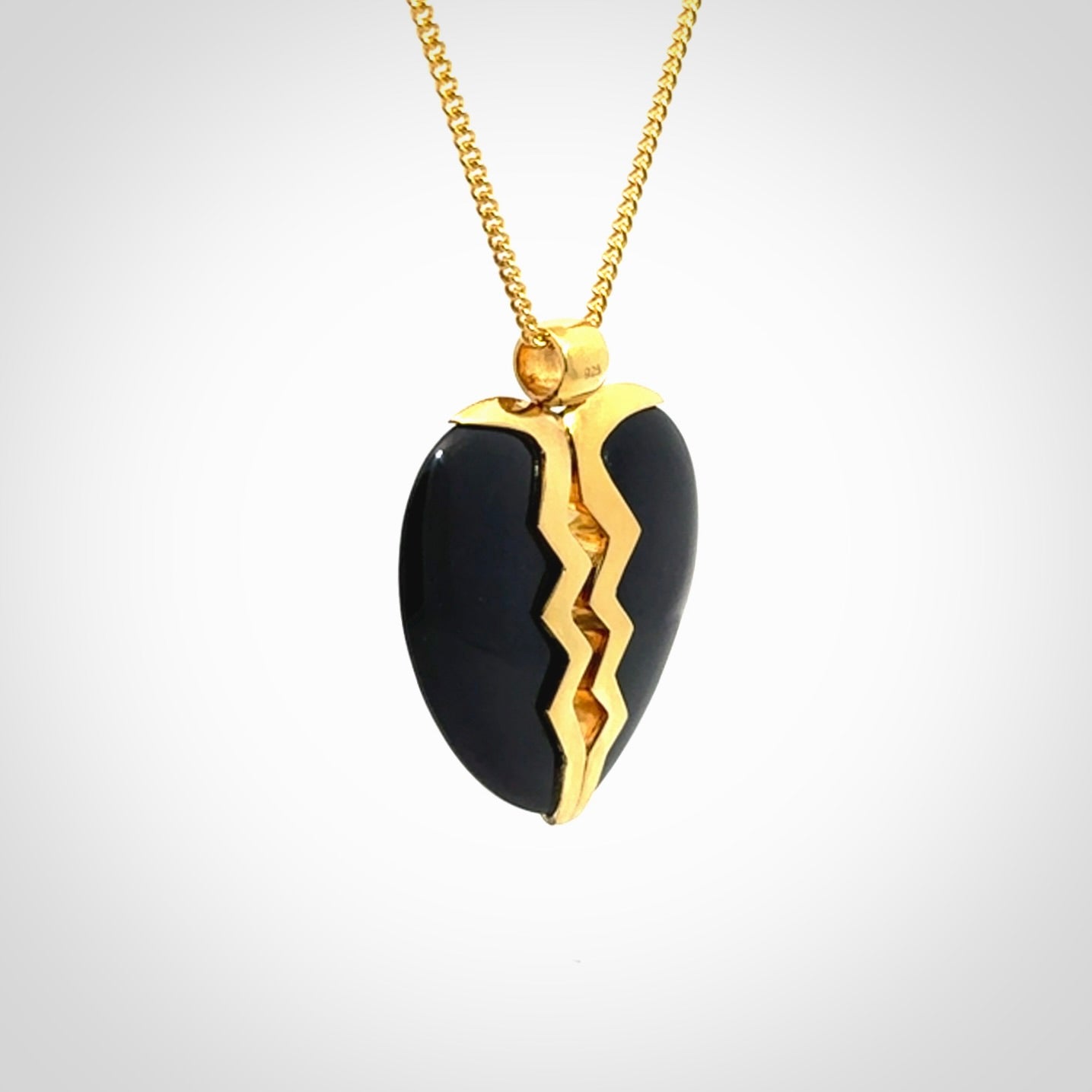 This is a handcarved love heart pendant made from a gorgeous and striking piece of Black Jade with gold plated silver. This is a superbly carved and very unique piece if custom jewellery. For sale online from NZ Pacific.