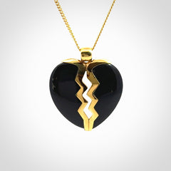 This is a handcarved love heart pendant made from a gorgeous and striking piece of Black Jade with gold plated silver. This is a superbly carved and very unique piece if custom jewellery. For sale online from NZ Pacific.