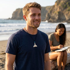 Man wearing bone whaletail pendant