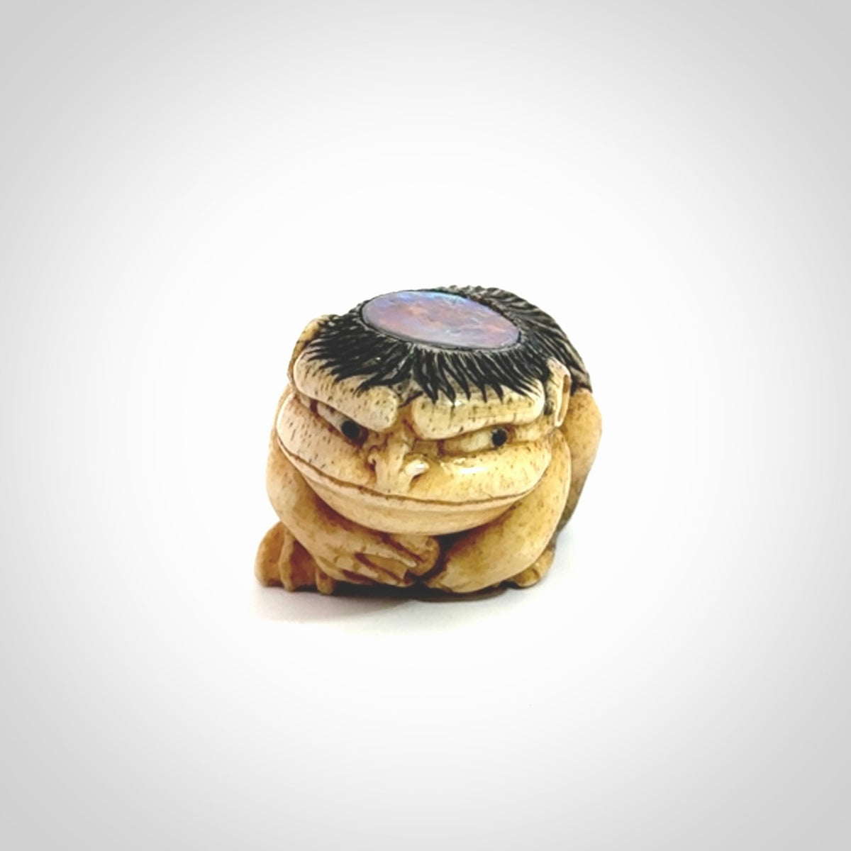 Hand carved incredible Kappa holding cucumber carving in deer antler with paua shell and buffalo horn. A one off collectors item that has been hand crafted to be displayed.