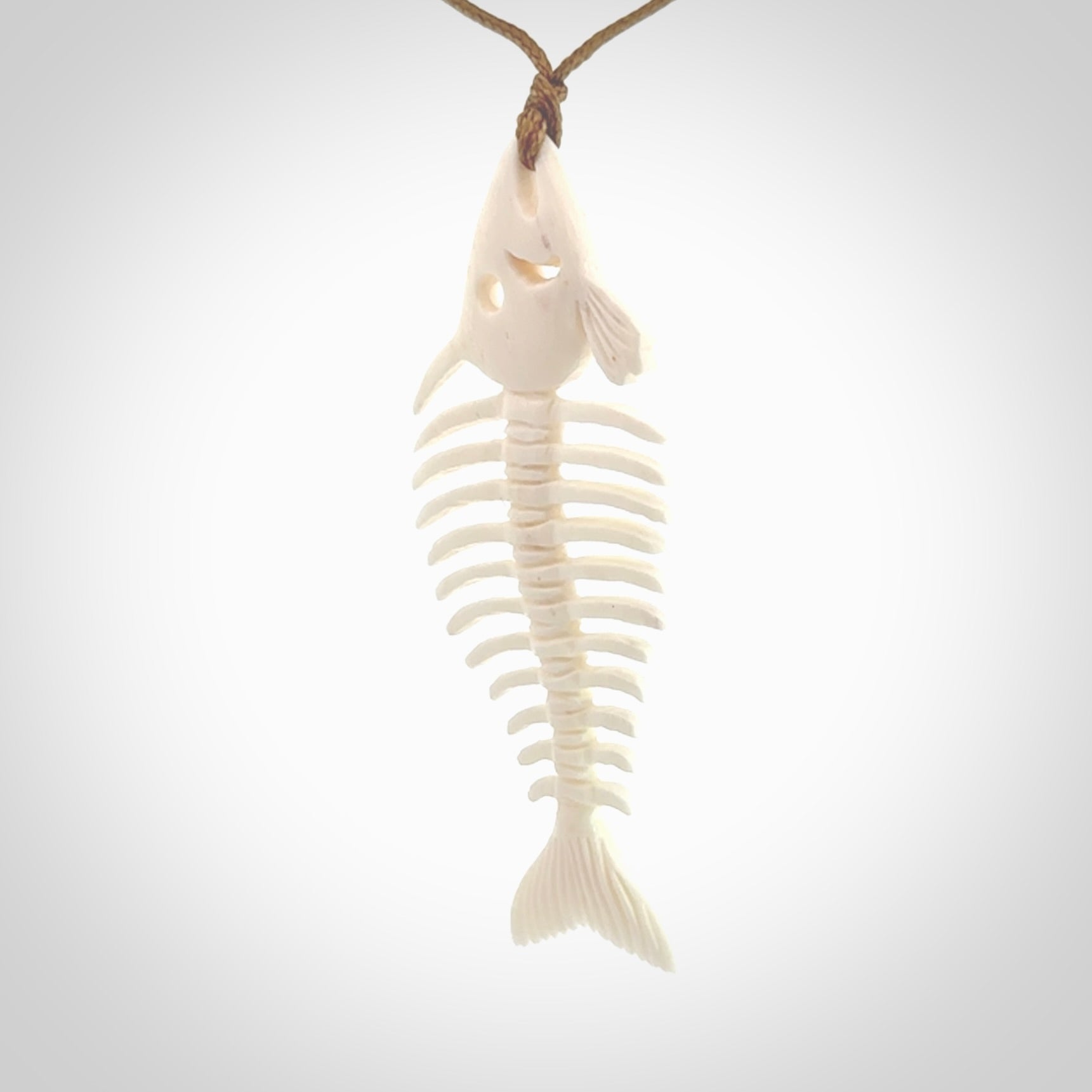 Hand carved bone fish skeleton pendant. Hand made bone fish necklace. Fish themed jewellery. Ocean themed pendant. One only necklace provided with adjustable cord and free delivery.