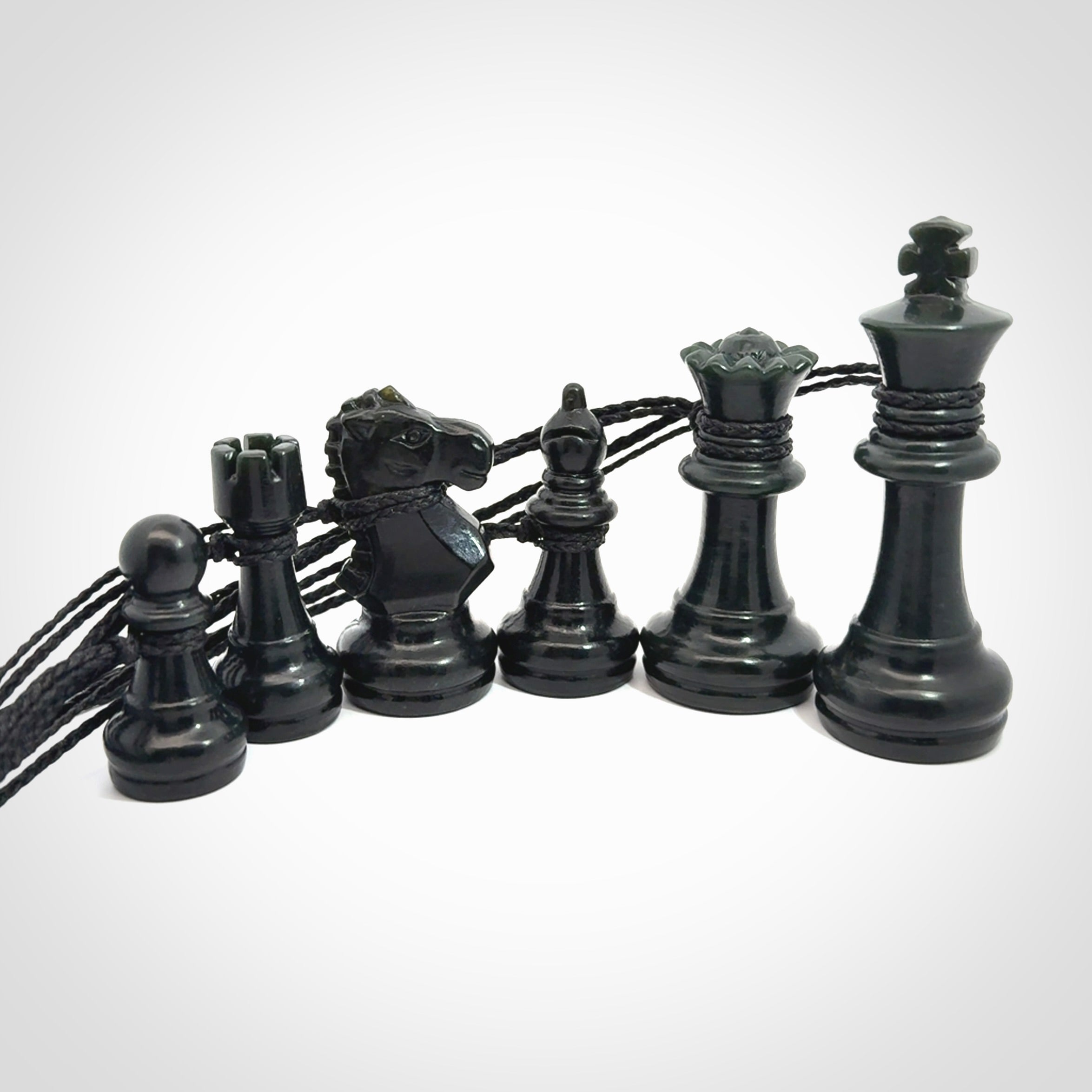 Hand carved jade chess pendants. Hand made chess piece necklaces, carved from British Columbian Jade.