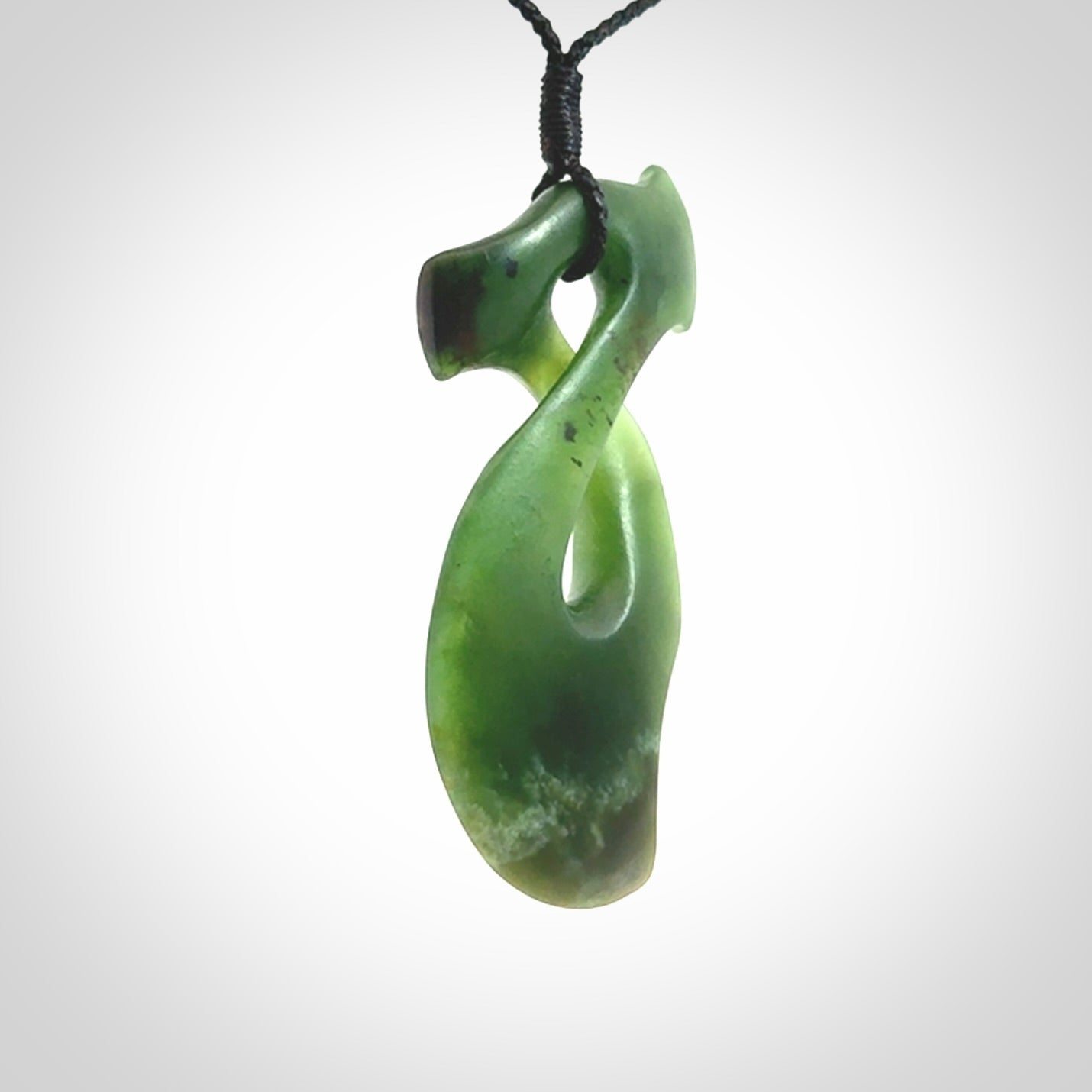 This hammerhead twist pendant is carved from a very striking New Zealand jade