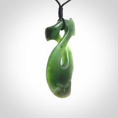 This hammerhead twist pendant is carved from a very striking New Zealand jade