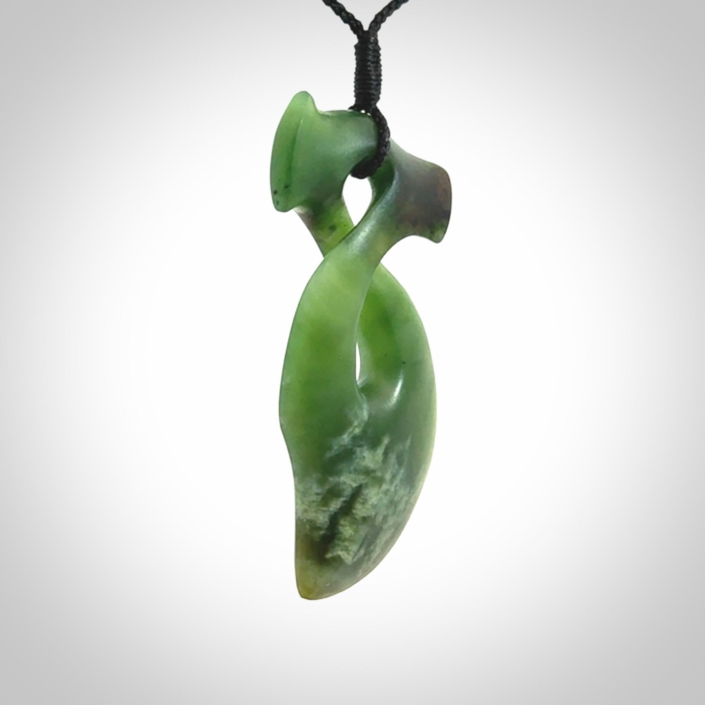 This hammerhead twist pendant is carved from a very striking New Zealand jade