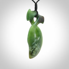 This hammerhead twist pendant is carved from a very striking New Zealand jade