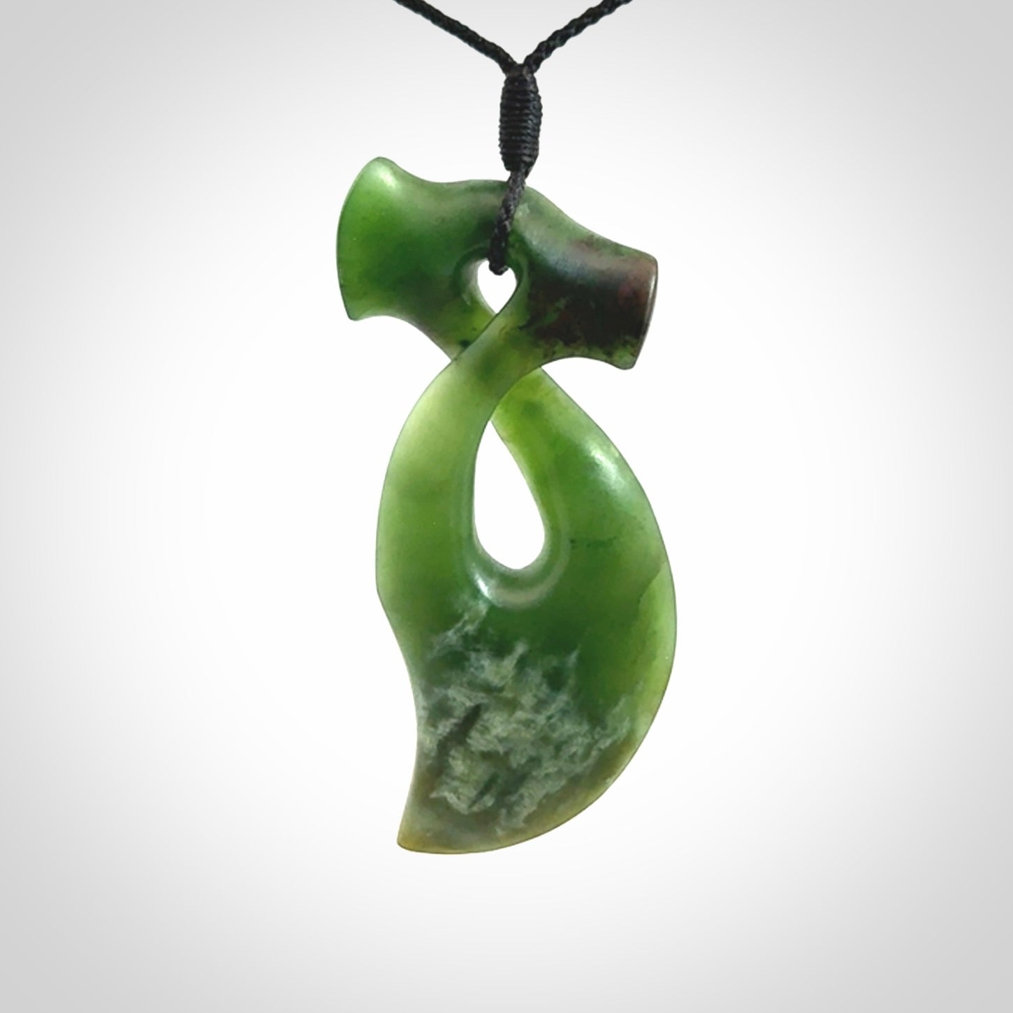 This hammerhead twist pendant is carved from a very striking New Zealand jade