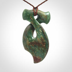 This hammerhead twist pendant is carved from a very striking New Zealand jade