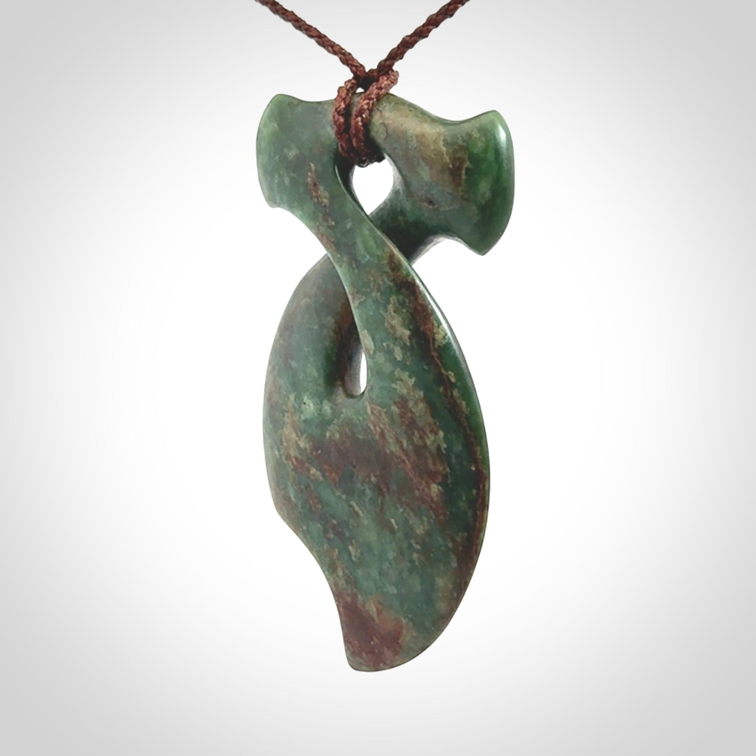 This hammerhead twist pendant is carved from a very striking New Zealand jade