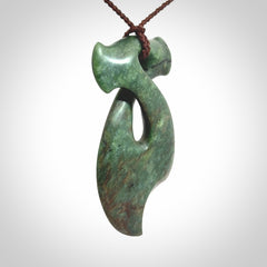 This hammerhead twist pendant is carved from a very striking New Zealand jade