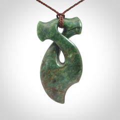 This hammerhead twist pendant is carved from a very striking New Zealand jade