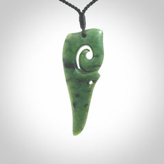 Hand carved huia bird skull made from New Zealand Marsden Jade pendant. Carved for NZ Pacific by Kyohei Noguchi. This is a contemporary piece of jewellery that is carved with intricate detail and clearly shows a beautiful bird skull. We ship this free worldwide with DHL Express Courier.