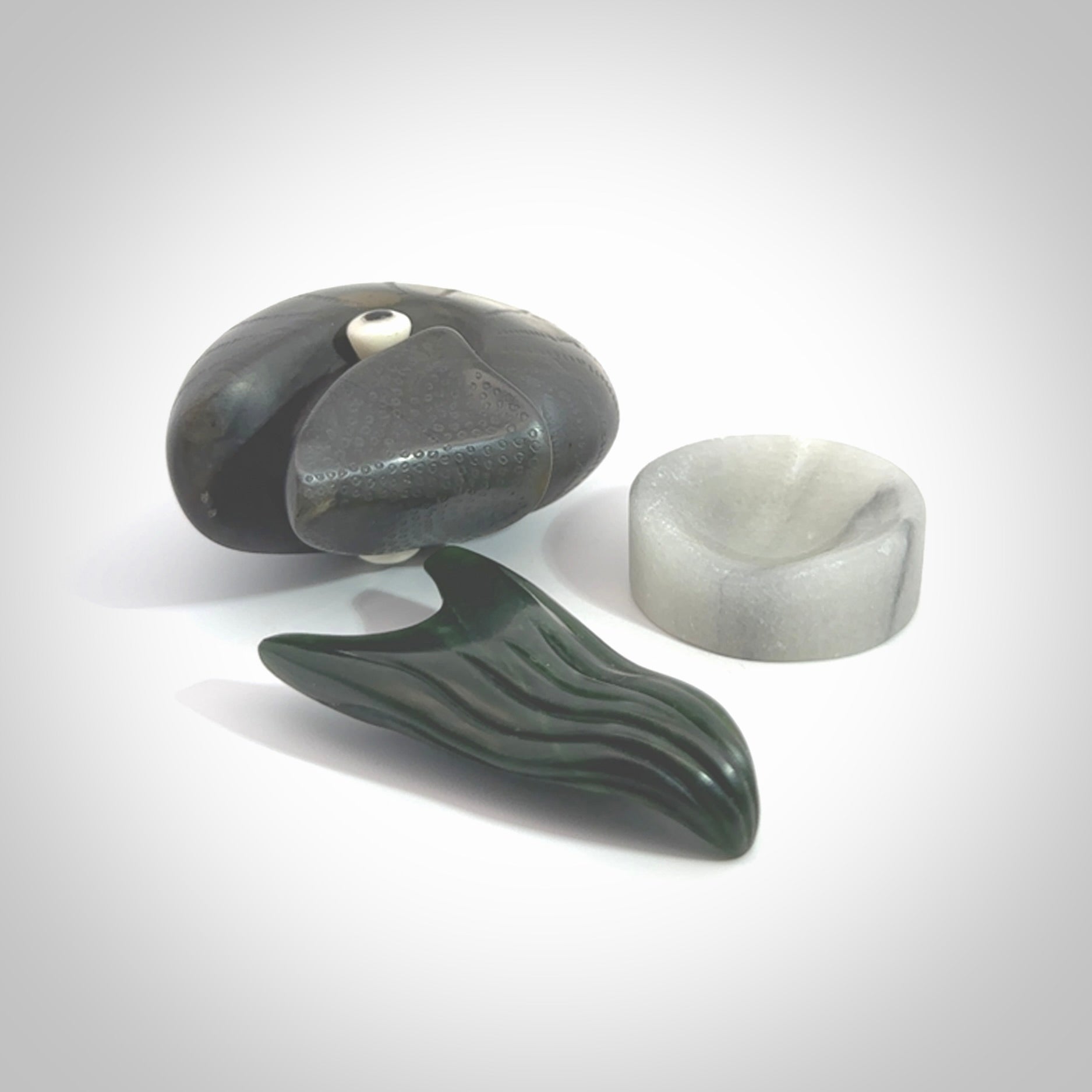Hand carved New Zealand Jade Nautilus sculpture with Argillite, Bone and Buffalo Horn eyes and Marble stand. Hand made Jade Nautilus sculpture.