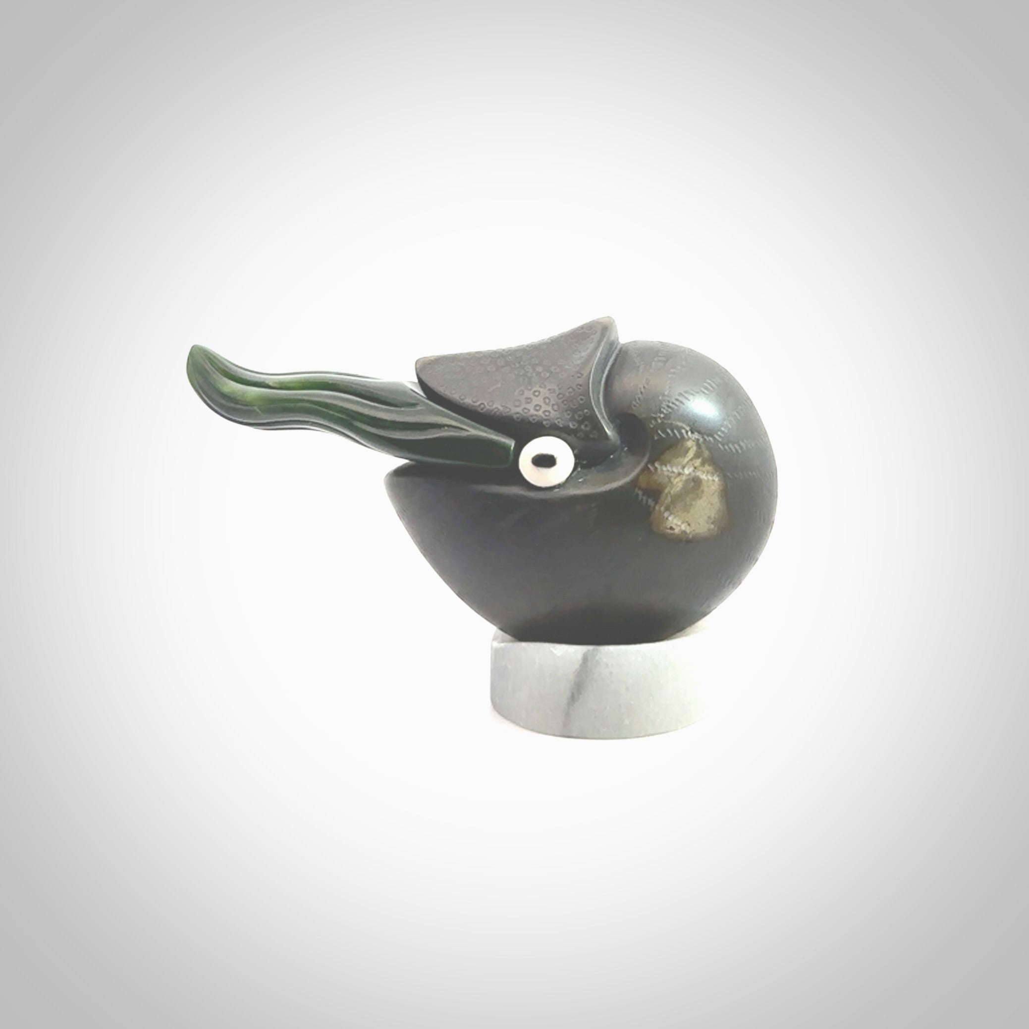 Hand carved New Zealand Jade Nautilus sculpture with Argillite, Bone and Buffalo Horn eyes and Marble stand. Hand made Jade Nautilus sculpture.