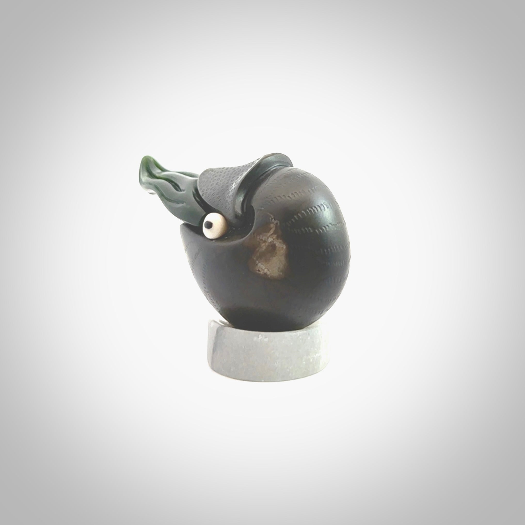 Hand carved New Zealand Jade Nautilus sculpture with Argillite, Bone and Buffalo Horn eyes and Marble stand. Hand made Jade Nautilus sculpture.