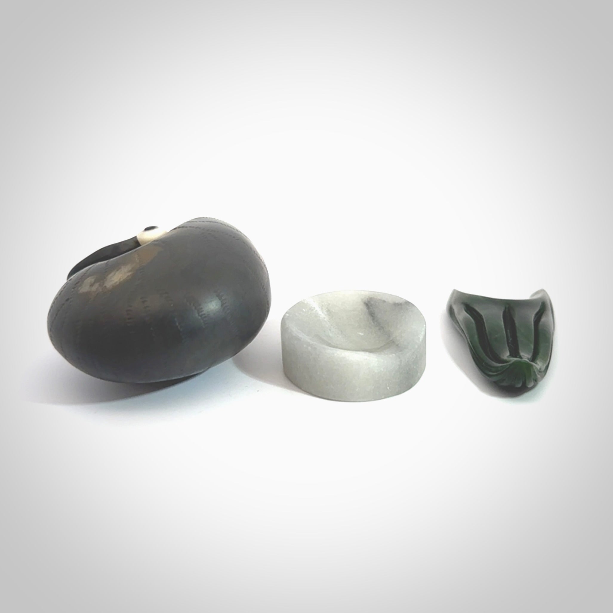 Hand carved New Zealand Jade Nautilus sculpture with Argillite, Bone and Buffalo Horn eyes and Marble stand. Hand made Jade Nautilus sculpture.