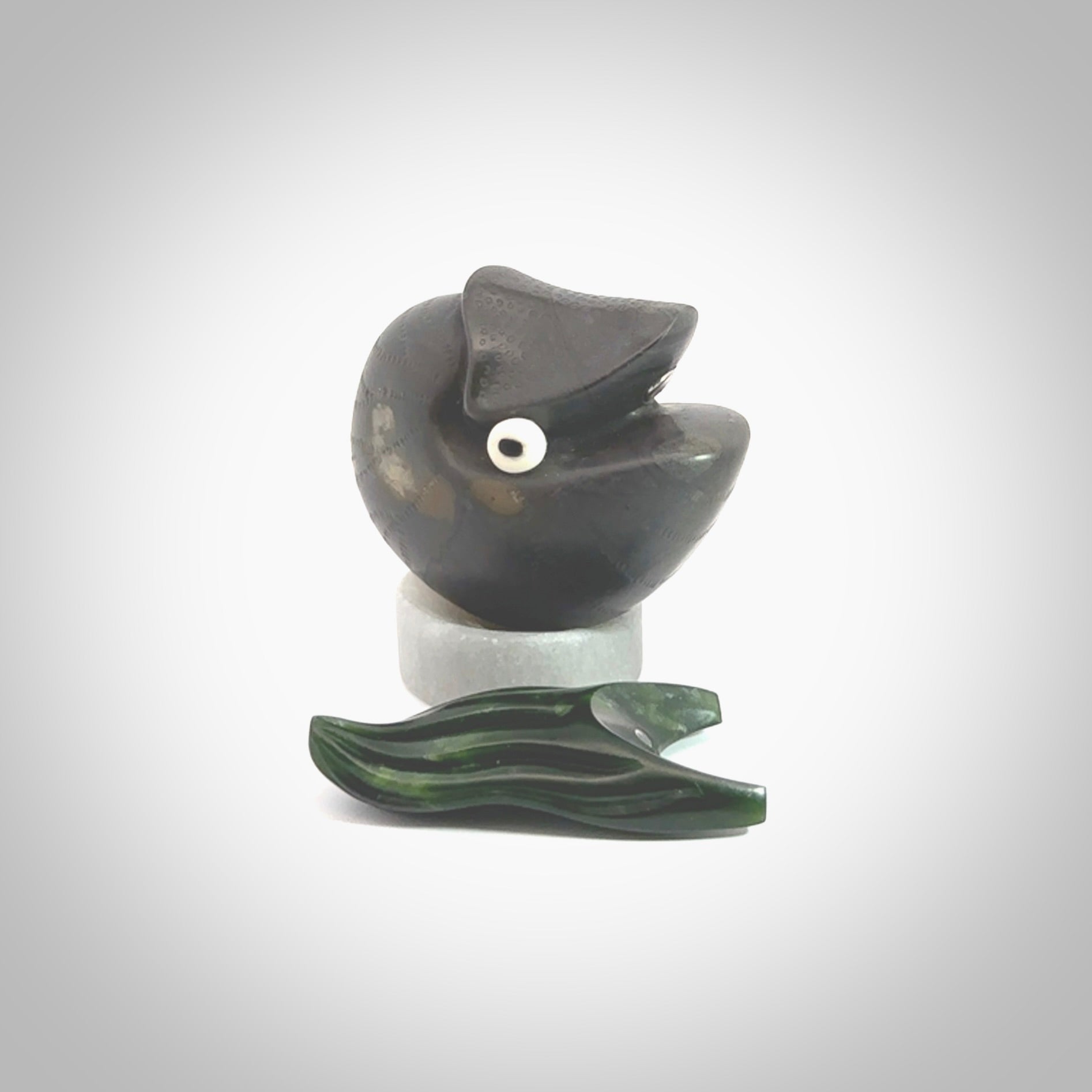 Hand carved New Zealand Jade Nautilus sculpture with Argillite, Bone and Buffalo Horn eyes and Marble stand. Hand made Jade Nautilus sculpture.