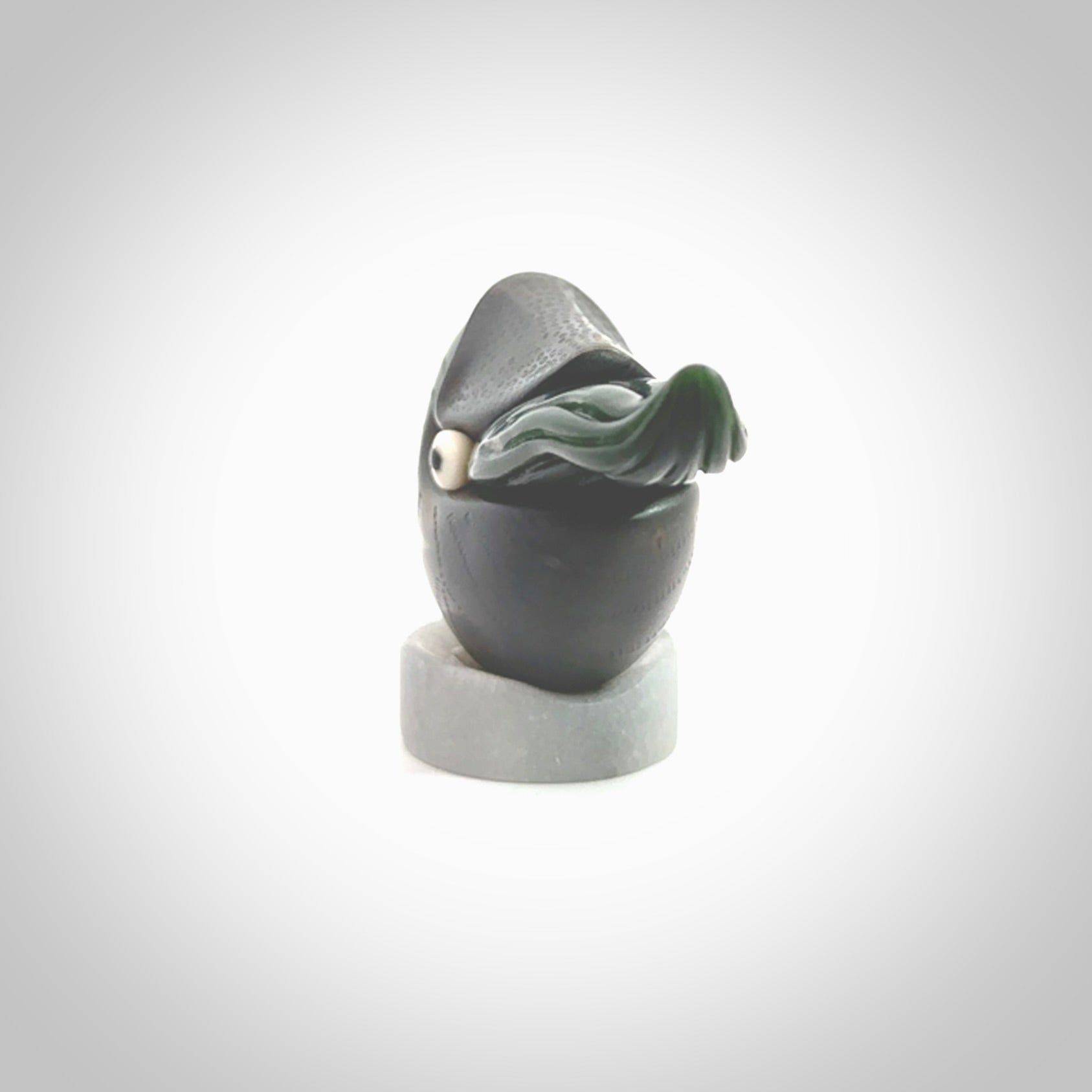 Hand carved New Zealand Jade Nautilus sculpture with Argillite, Bone and Buffalo Horn eyes and Marble stand. Hand made Jade Nautilus sculpture.