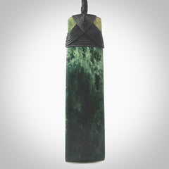 Hand carved from a lovely piece of local New Zealand Marsden Jade. The quality of the workmanship and design is outstanding - this is a piece you will want to wear all the time. We have suspended this from a 4-plait black cord which can be adjusted with a couple of slip knots and black binding. Hand made by Kyohei Noguchi.