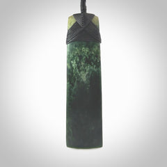 Hand carved from a lovely piece of local New Zealand Marsden Jade. The quality of the workmanship and design is outstanding - this is a piece you will want to wear all the time. We have suspended this from a 4-plait black cord which can be adjusted with a couple of slip knots and black binding. Hand made by Kyohei Noguchi.
