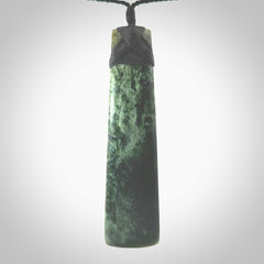 Hand carved from a lovely piece of local New Zealand Marsden Jade. The quality of the workmanship and design is outstanding - this is a piece you will want to wear all the time. We have suspended this from a 4-plait black cord which can be adjusted with a couple of slip knots and black binding. Hand made by Kyohei Noguchi.