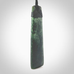 Hand carved from a lovely piece of local New Zealand Marsden Jade. The quality of the workmanship and design is outstanding - this is a piece you will want to wear all the time. We have suspended this from a 4-plait black cord which can be adjusted with a couple of slip knots and black binding. Hand made by Kyohei Noguchi.