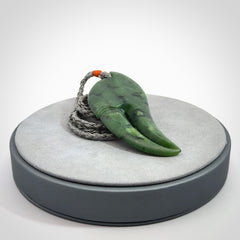 This large crab claw pendant is carved from a lovely deep green piece of New Zealand jade. It has an adjustable silver coloured cord which can be slipped over the head and adjusted to the length that you prefer. Hand carved in New Zealand from our local jade by Kyohei Noguchi.