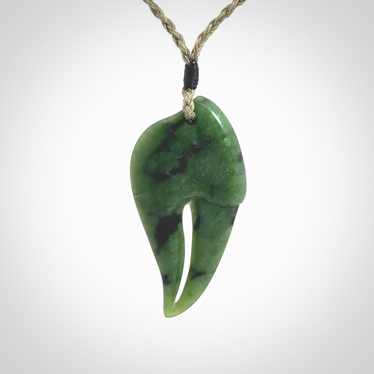 This large crab claw pendant is carved from a lovely deep green piece of New Zealand jade. It has an adjustable Khaki coloured cord which can be slipped over the head and adjusted to the length that you prefer. Hand carved in New Zealand from our local jade by Kyohei Noguchi.