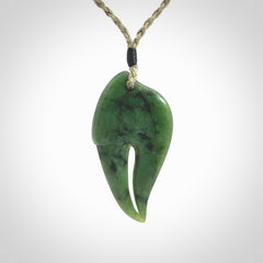This large crab claw pendant is carved from a lovely deep green piece of New Zealand jade. It has an adjustable Khaki coloured cord which can be slipped over the head and adjusted to the length that you prefer. Hand carved in New Zealand from our local jade by Kyohei Noguchi.