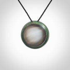 This pendant is a medium sized double koru necklace carved from a New Zealand Jade with Mother of Pearl inlay. Kyohei Noguchi carved this piece for us so the workmanship is outstanding. Handmade in New Zealand, a beautiful piece of jade jewellery.