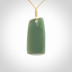 This is a lovely New Zealand Inanga Jade, pounamu Toki drop pendant. Hand carved for us by Kyohei Noguchi. It is bound with an adjustable beige coloured cord which is length adjustable. Free worldwide shipping.