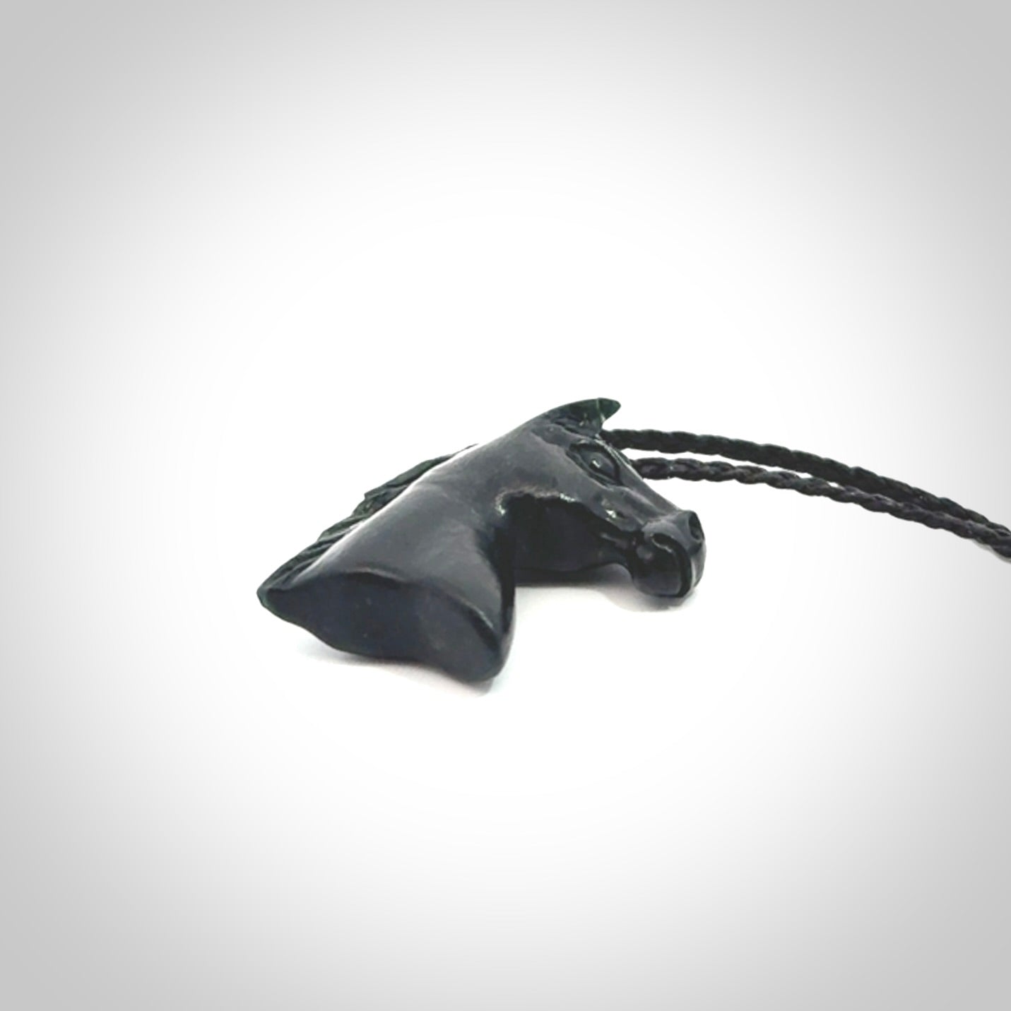 This medium sized horse pendant is made from New Zealand Jade. We've hand carved this piece for all the horse lovers out there. Free postage worldwide. Jade Stone horse head jewellery.
