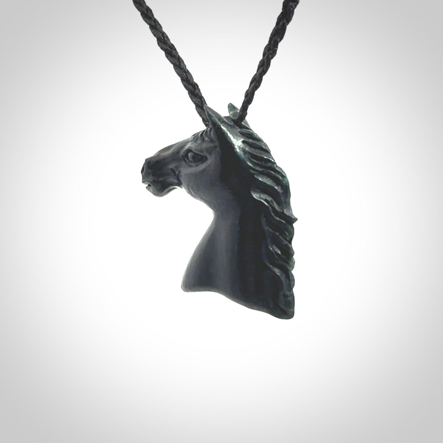 This medium sized horse pendant is made from New Zealand Jade. We've hand carved this piece for all the horse lovers out there. Free postage worldwide. Jade Stone horse head jewellery.
