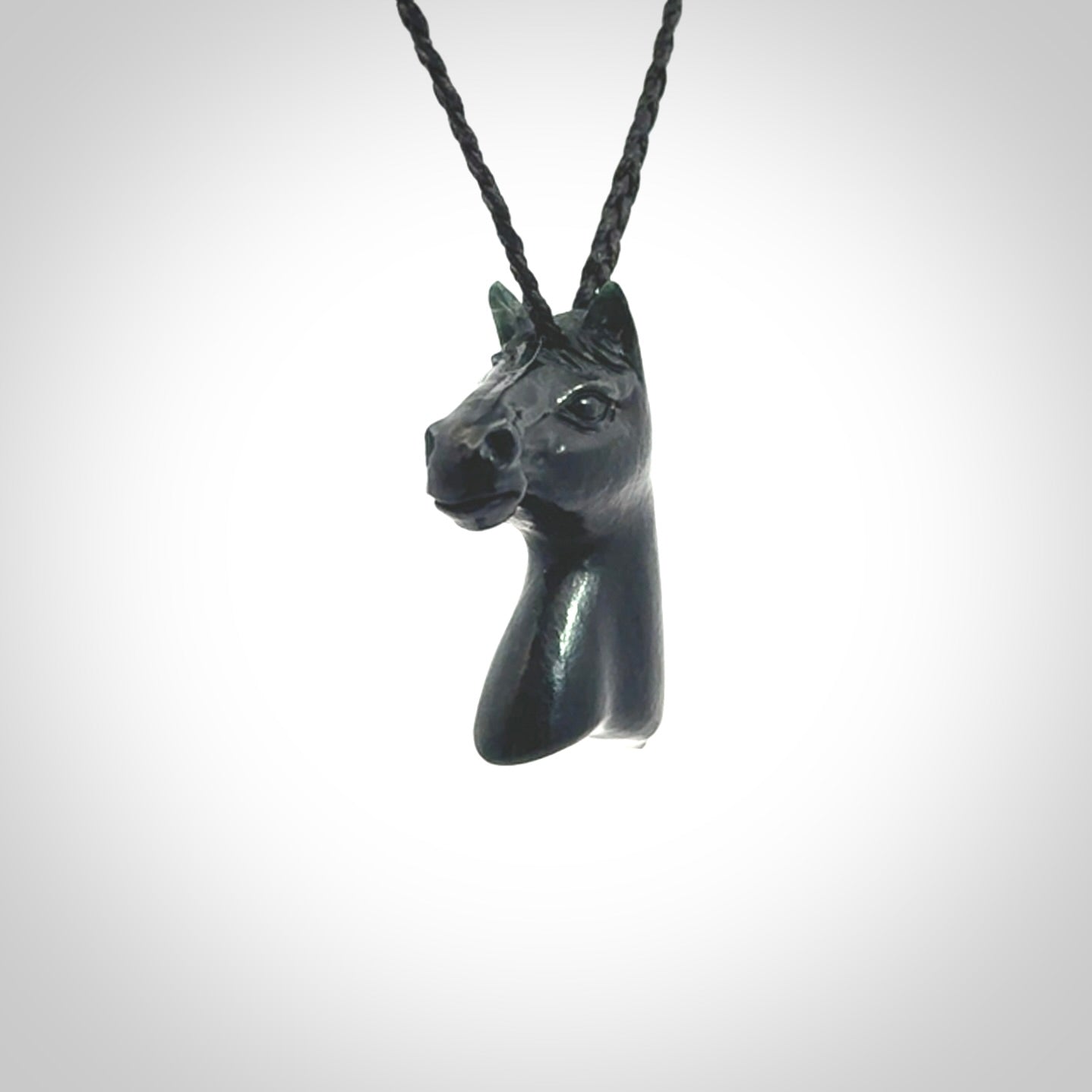 This medium sized horse pendant is made from New Zealand Jade. We've hand carved this piece for all the horse lovers out there. Free postage worldwide. Jade Stone horse head jewellery.