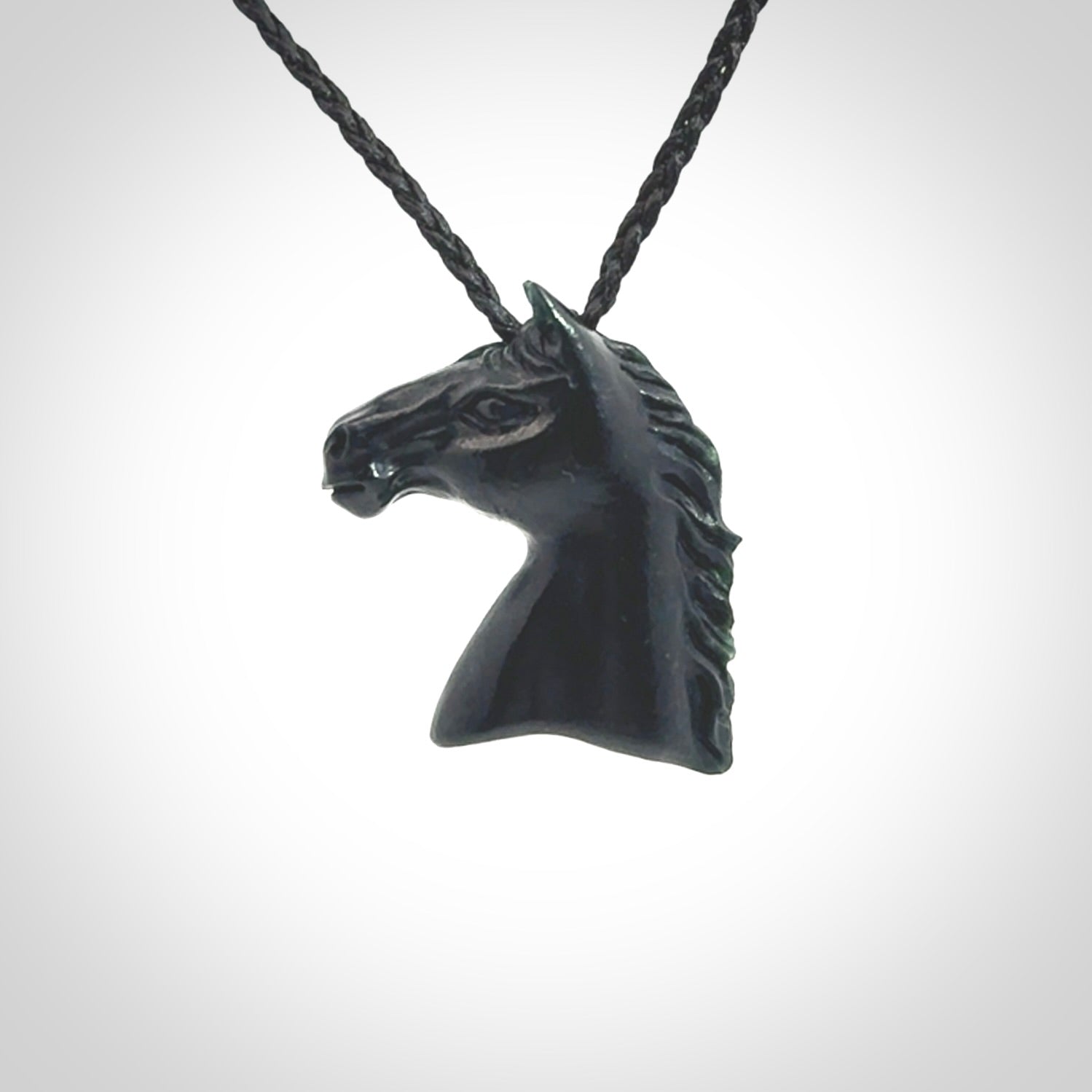 This medium sized horse pendant is made from New Zealand Jade. We've hand carved this piece for all the horse lovers out there. Free postage worldwide. Jade Stone horse head jewellery.
